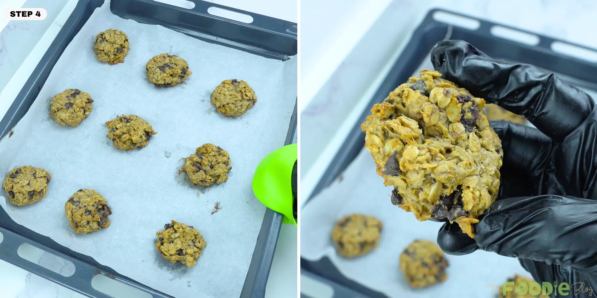 Hand holding a baked oatmeal chocolate chip cookie over a baking tray