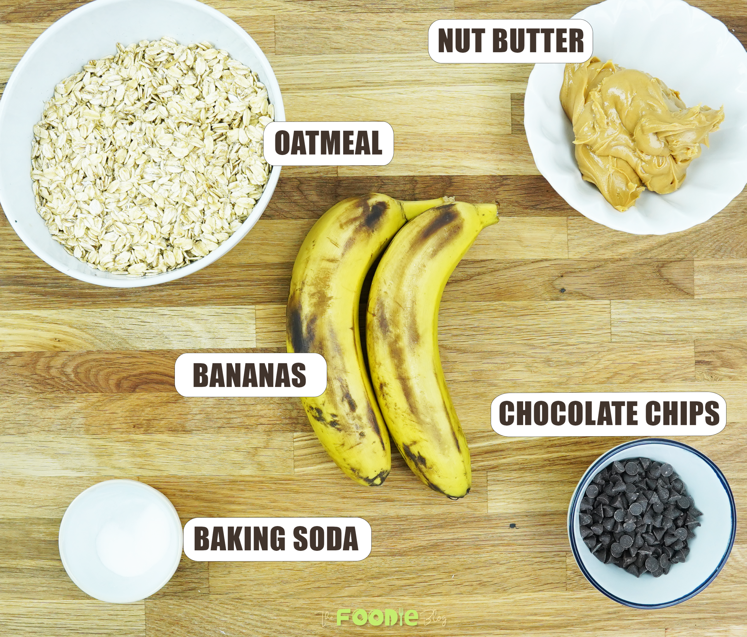 Ingredients labeled for oatmeal chocolate chip cookies including bananas, oatmeal, nut butter, chocolate chips, and baking soda