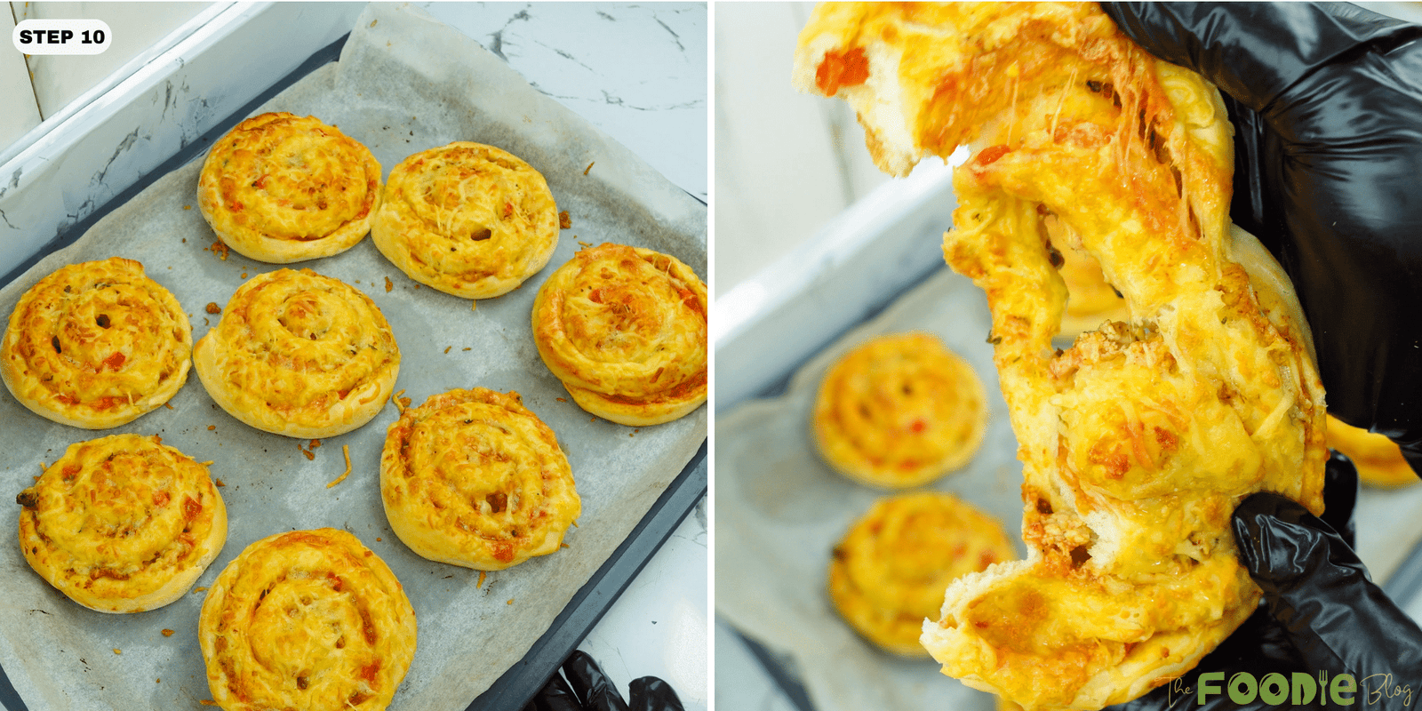 Baked pizza rolls on a tray with one roll pulled apart showing stretchy melted cheese
