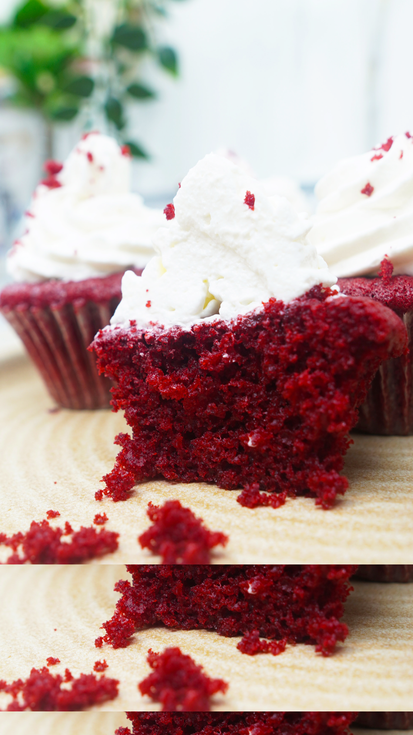 Bite-sized piece of red velvet cupcake with cream cheese frosting in the foreground