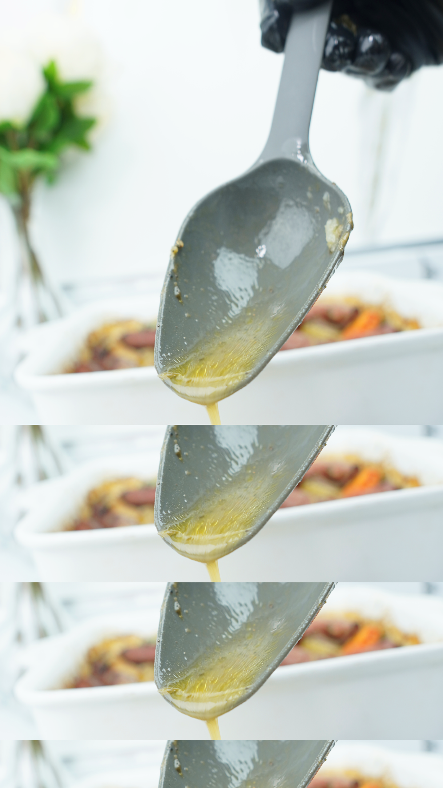 Plated sausage bake with browned sausages, potatoes, carrots, and onions topped with warm gravy.