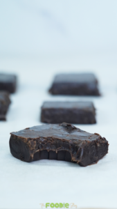 3 ingredient chocolate fudge bite close up showing smooth creamy texture