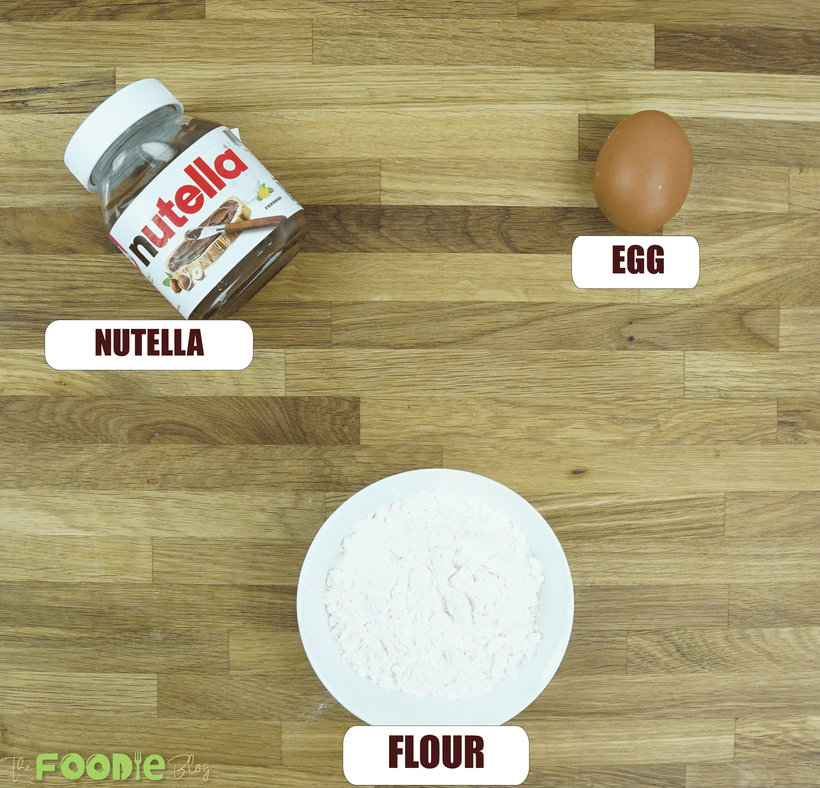 Overhead view of Nutella, egg, and flour for 3-Ingredient Nutella Cookies
