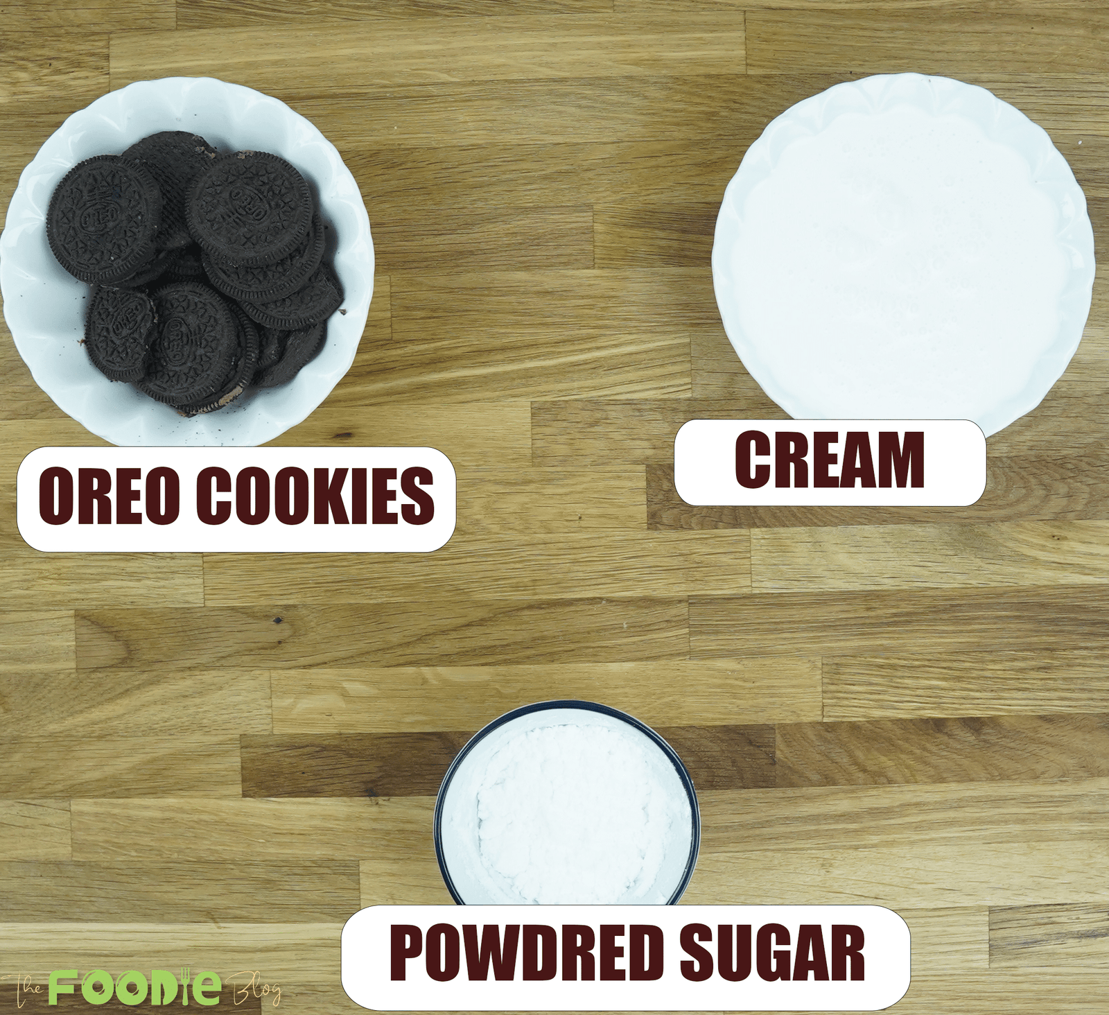 Overhead view of Oreo cookies, heavy cream, and powdered sugar for 3-Ingredient Oreo Mousse