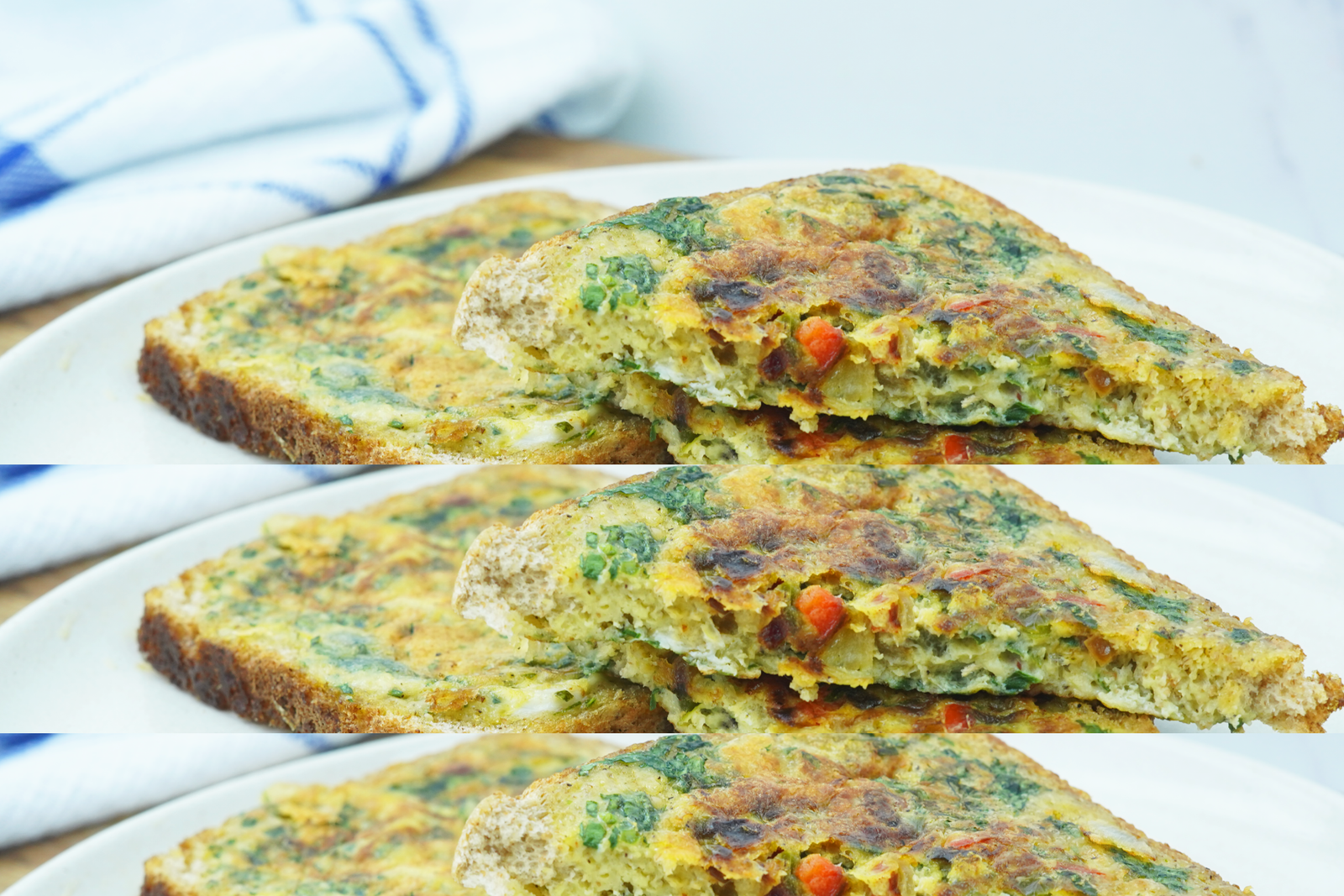 Two slices of bread omelette on a light plate with one piece stacked on top to show the filling