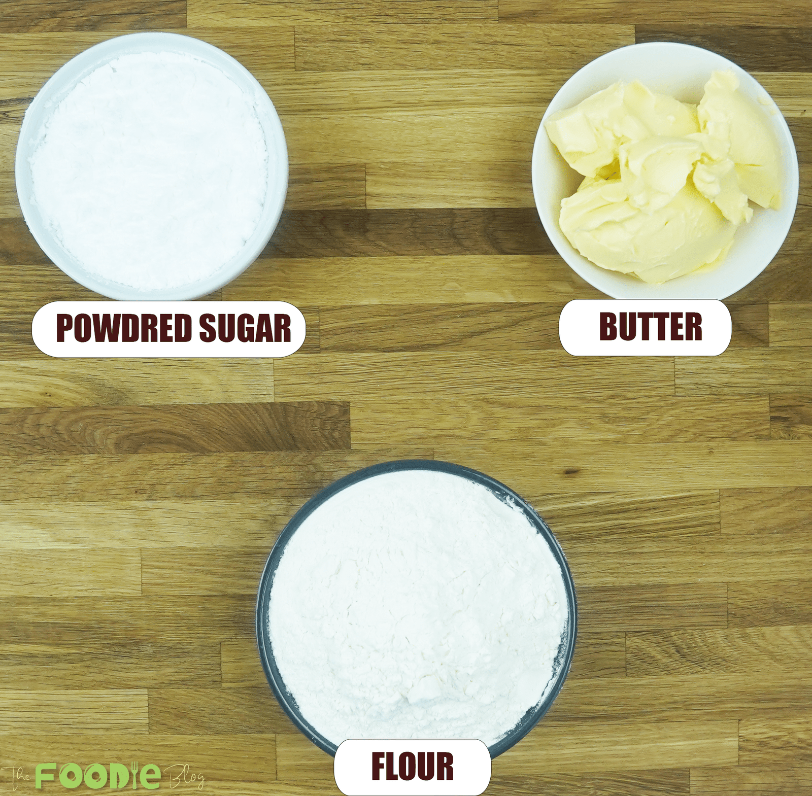 Overhead view of powdered sugar, butter, and flour for butter cookies