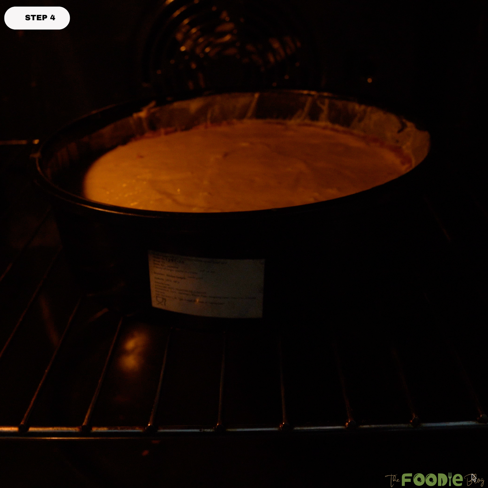 Pumpkin pie cheesecake baking in the oven in a round pan until the filling is set around the edges.