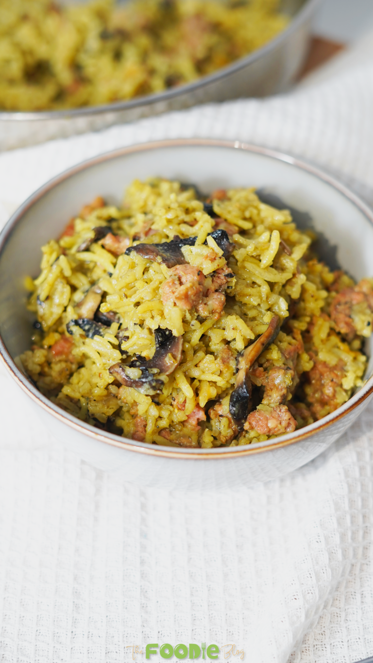 Close-up of ground turkey casserole in a bowl with fluffy rice, mushrooms, and turkey crumbles