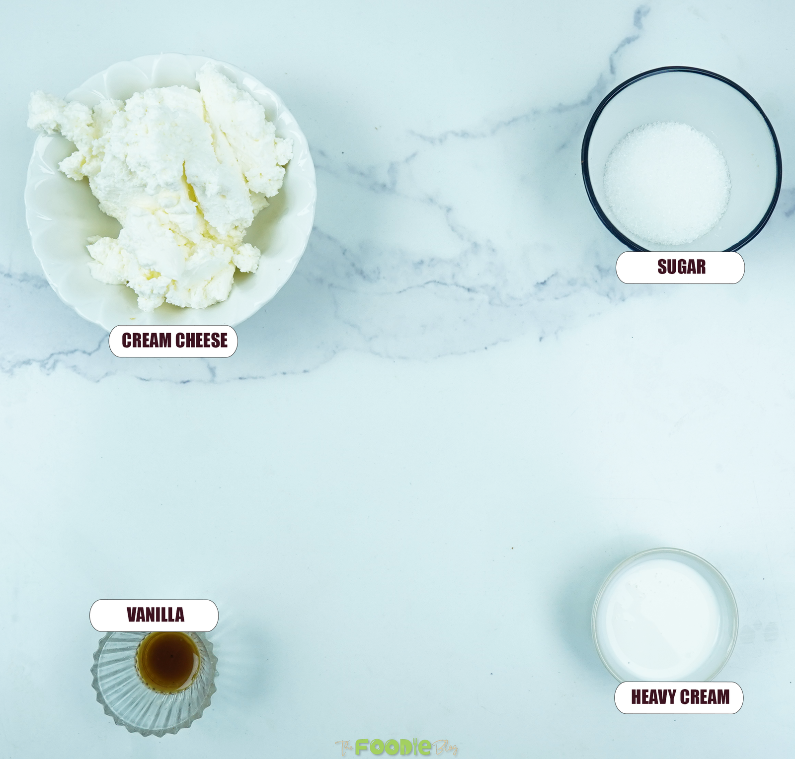 Ingredients for the cream cheese filling including cream cheese, sweetener, vanilla, and heavy cream