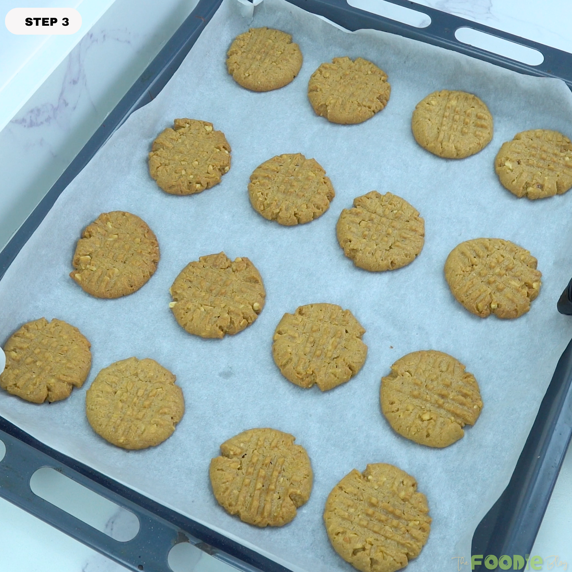 peanut butter cookies arranged on baking tray ready to bake
