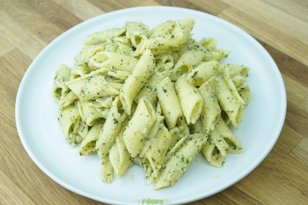 plated pesto pasta served on a white dish