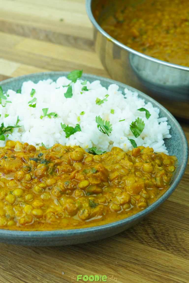 serving view of lentil curry with rice in a bowl