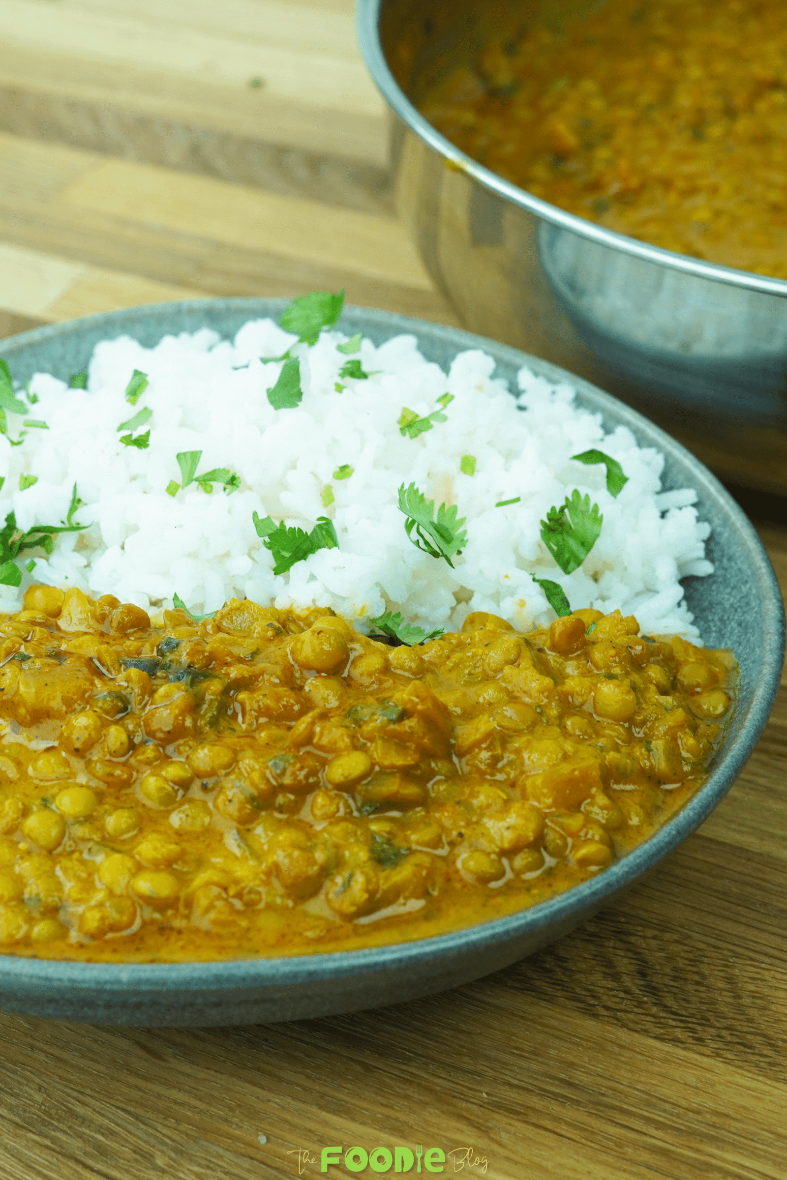 serving view of lentil curry with rice in a bowl