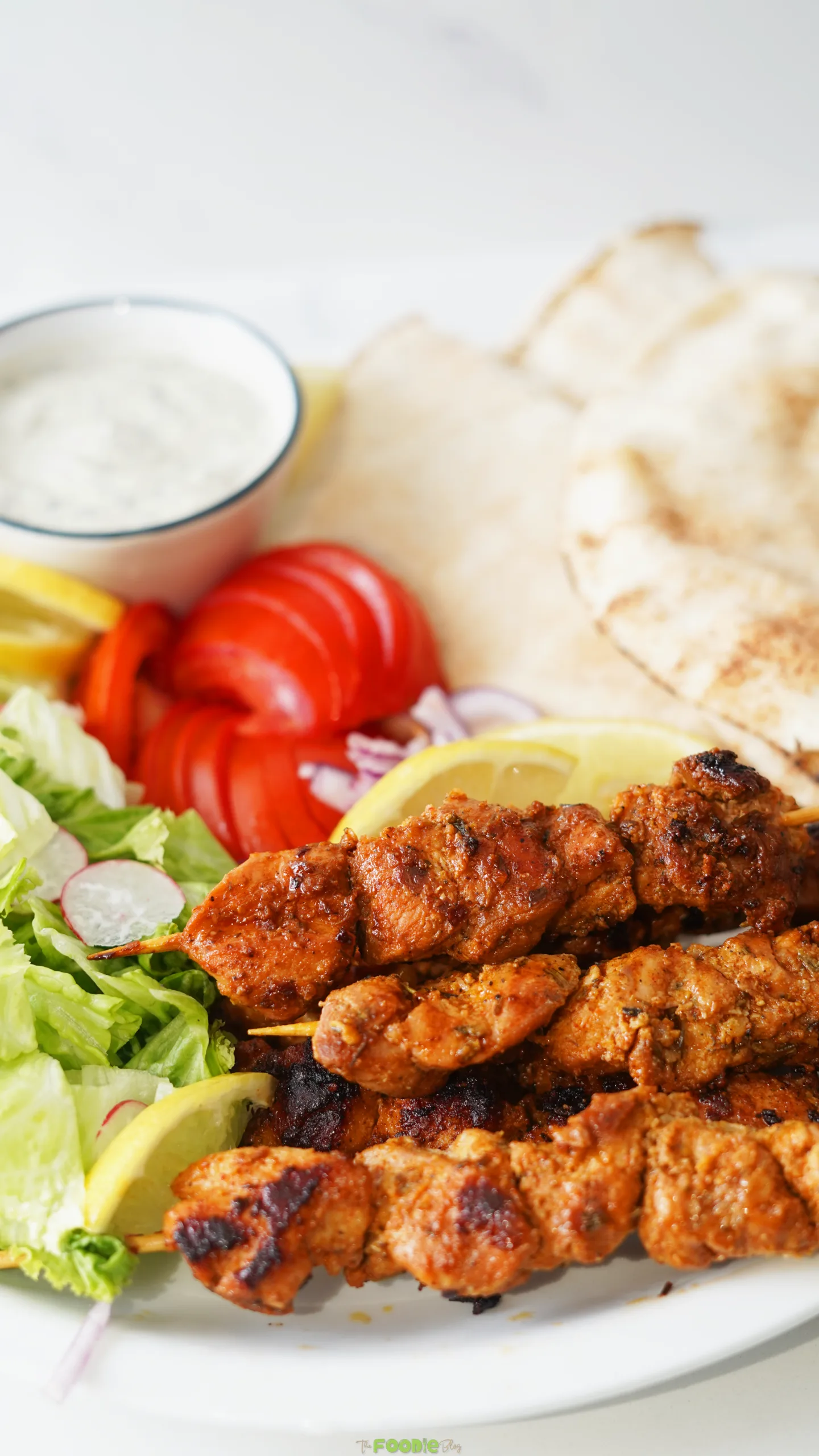 charcoal chicken shop chicken skewers in pita with salad and sauce
