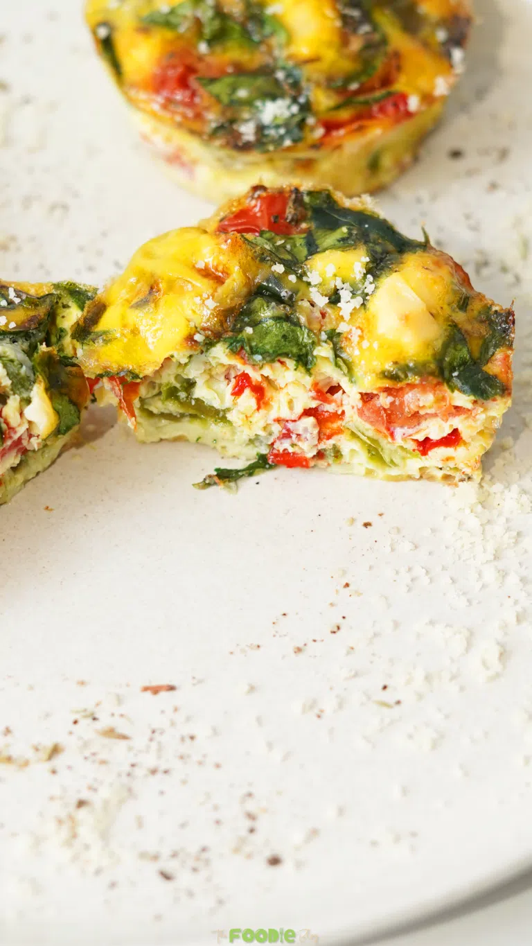 egg muffins with spinach peppers and feta baked in a muffin tin