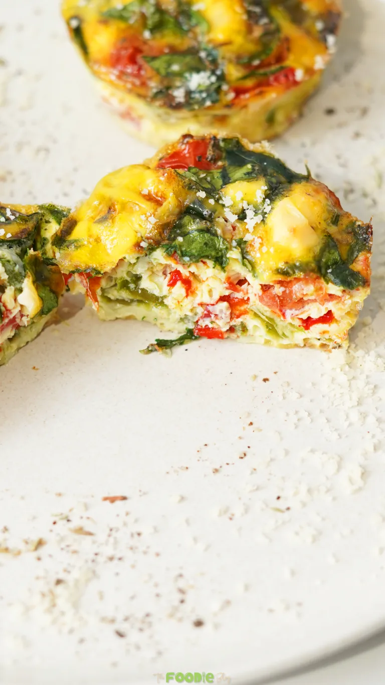 egg muffins with spinach peppers and feta baked in a muffin tin