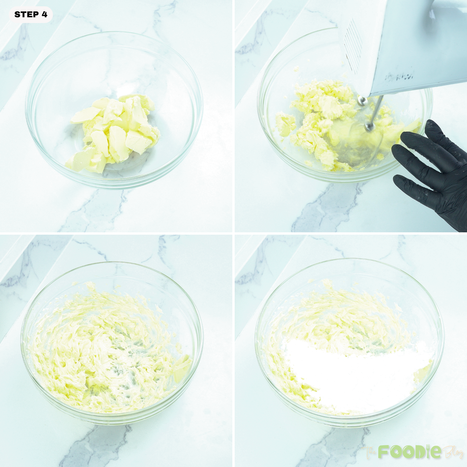 Butter being beaten in a glass bowl with powdered sugar added to make vanilla buttercream frosting.