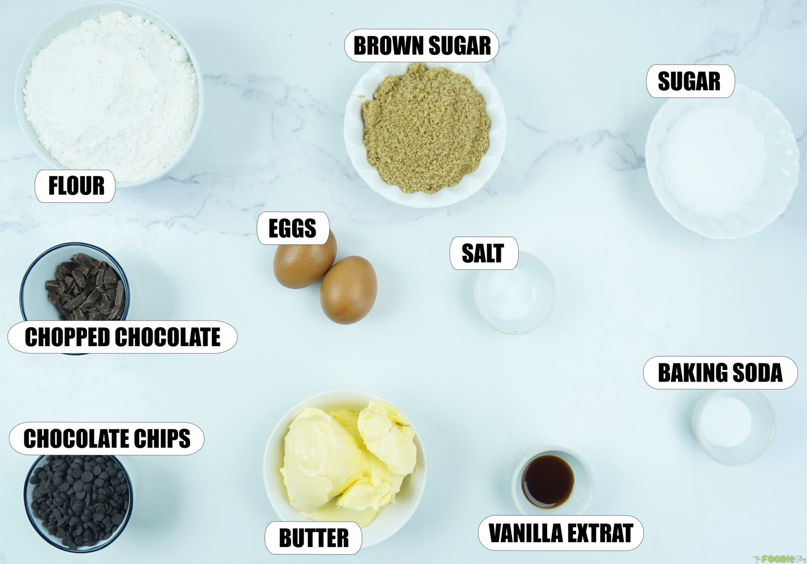 Ingredients for Best Chocolate Chip Cookies including flour, butter, eggs, brown sugar, sugar, vanilla, salt, baking soda, chocolate chips, and chopped chocolate.