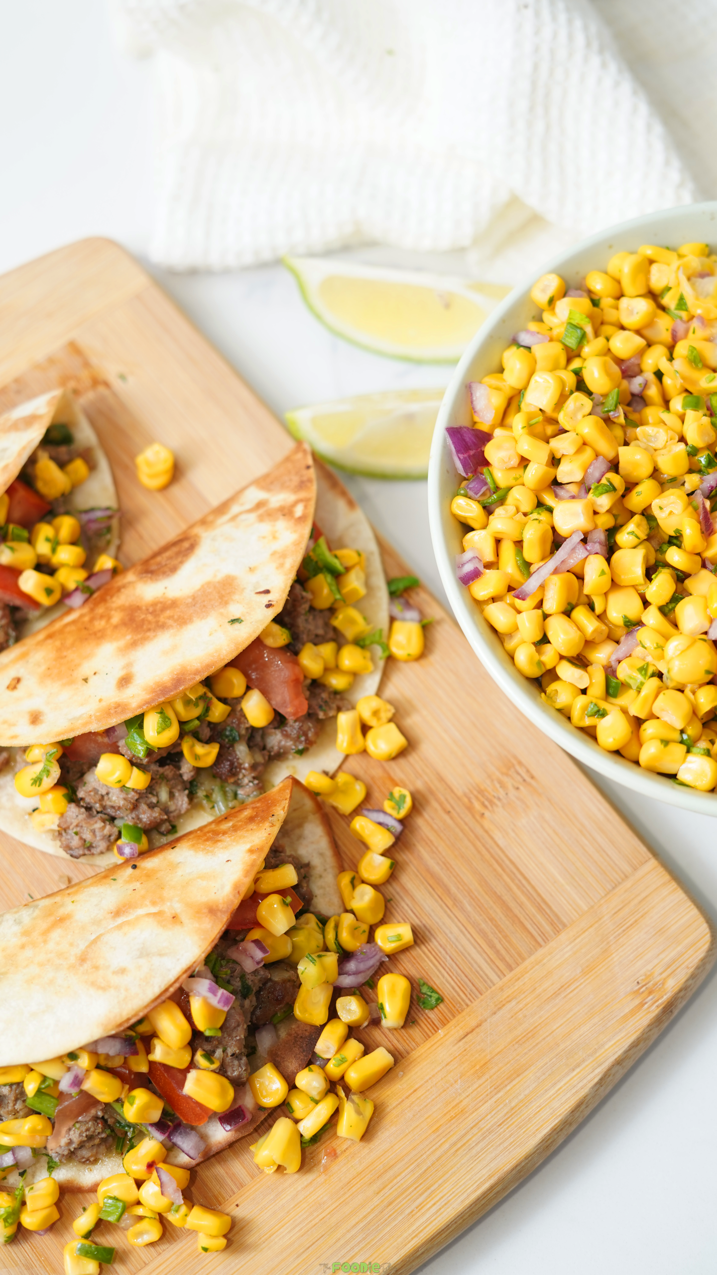 Corn salsa served beside tacos and spooned over taco filling.