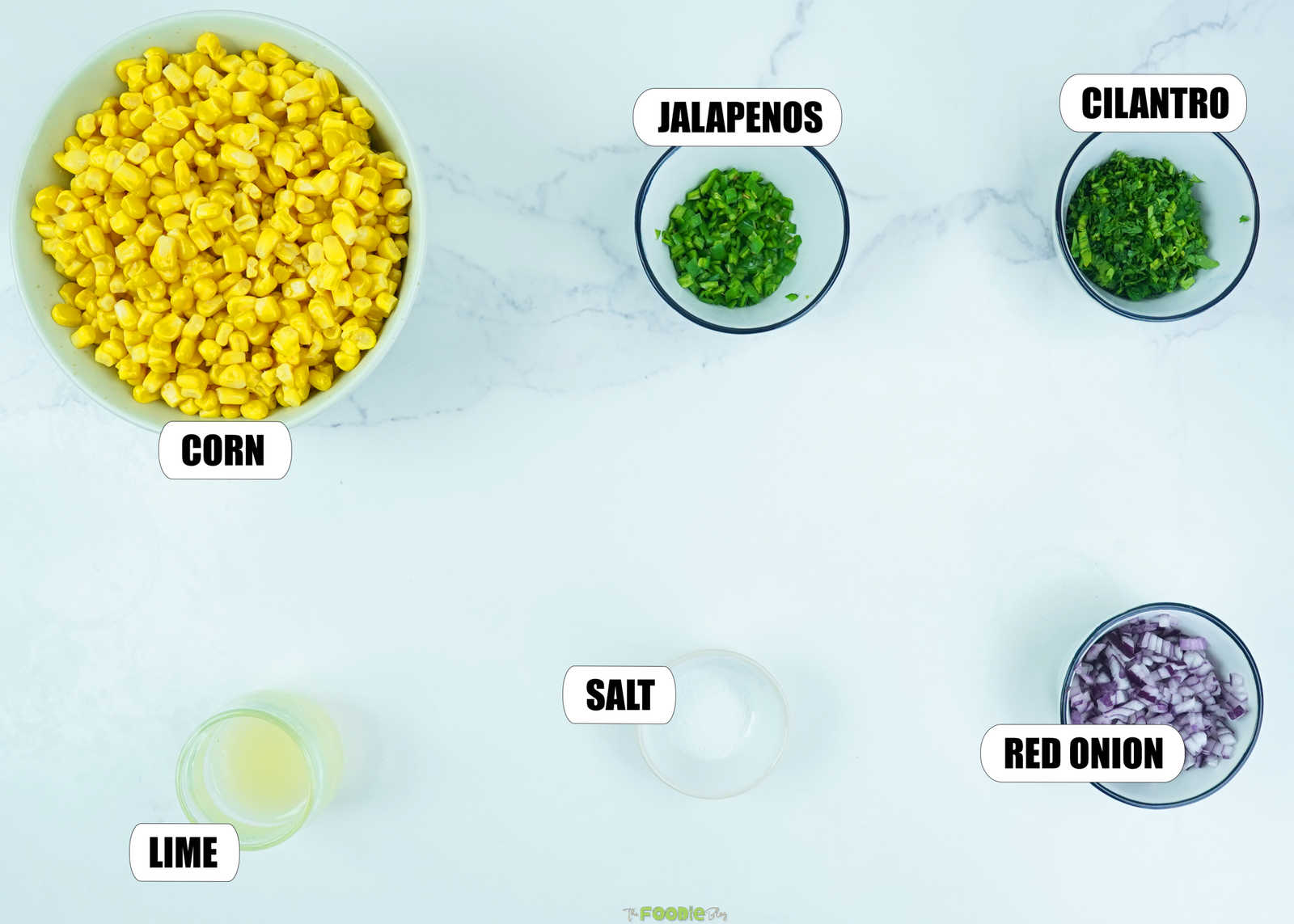 Corn, red onion, jalapeños, cilantro, lime juice, and salt for homemade corn salsa.