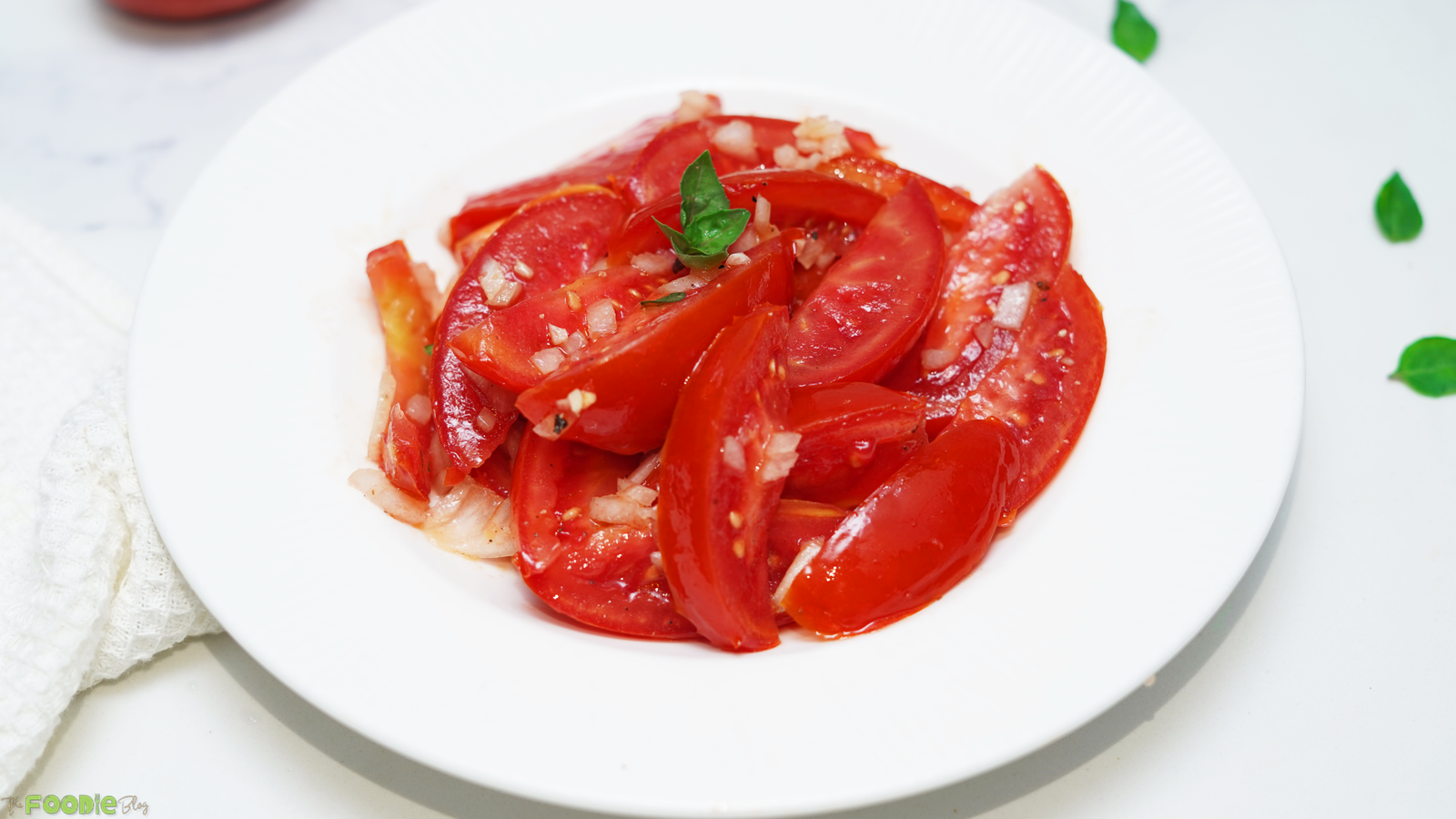 Fresh tomato wedges tossed with garlic, shallots, basil, olive oil, and vinegar.