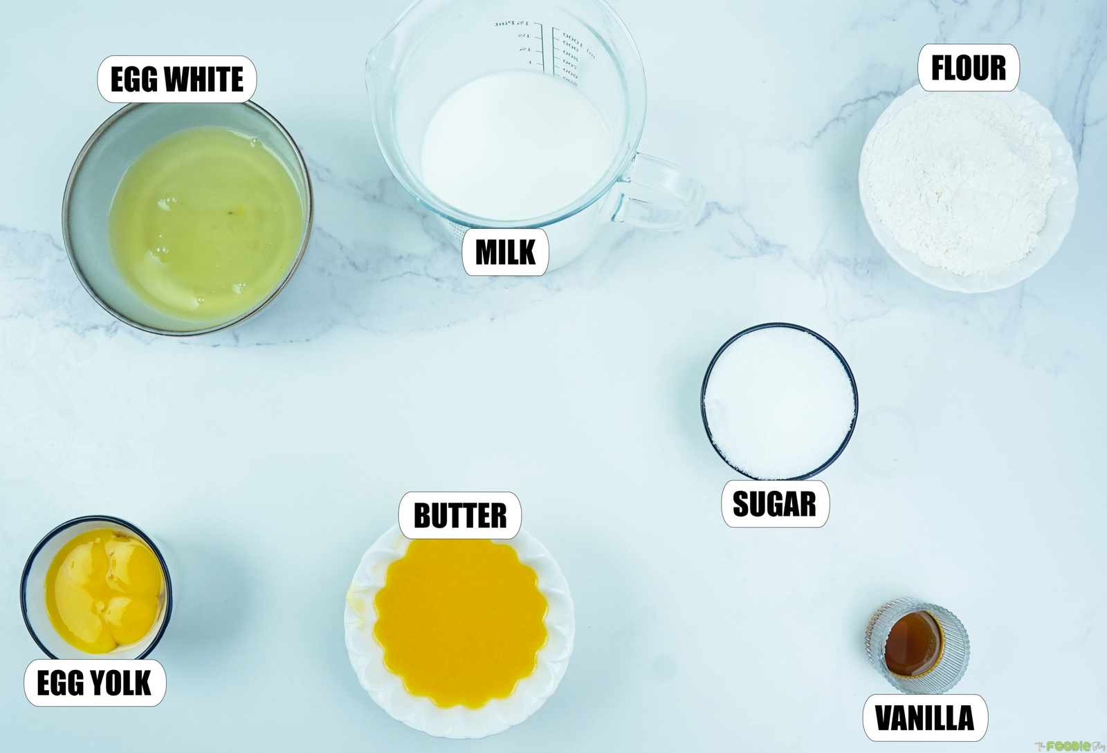 Egg whites, egg yolks, milk, flour, sugar, melted butter, and vanilla for custard cake.