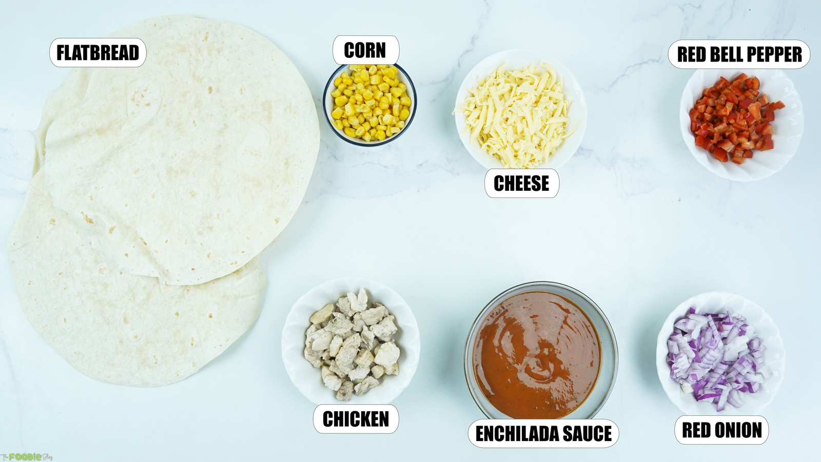 Flatbread, chicken, corn, enchilada sauce, mozzarella, bell pepper, and red onion for Mexican Pizzas.
