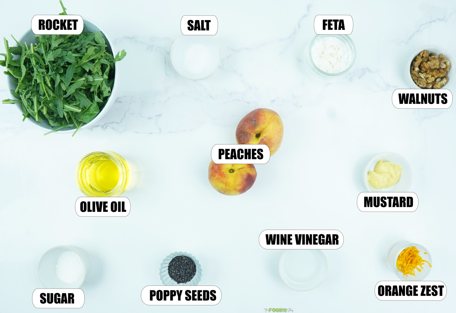 Ingredients for peach salad with arugula, peaches, feta, walnuts, olive oil, poppy seeds, mustard, vinegar, orange zest, sugar, and salt.