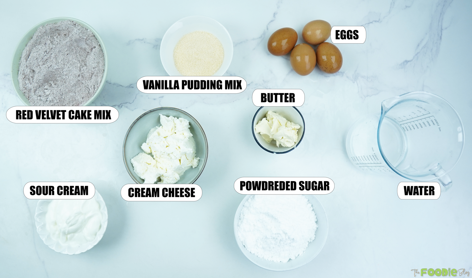 Red velvet cake mix, eggs, sour cream, pudding mix, cream cheese, butter, powdered sugar, and water.