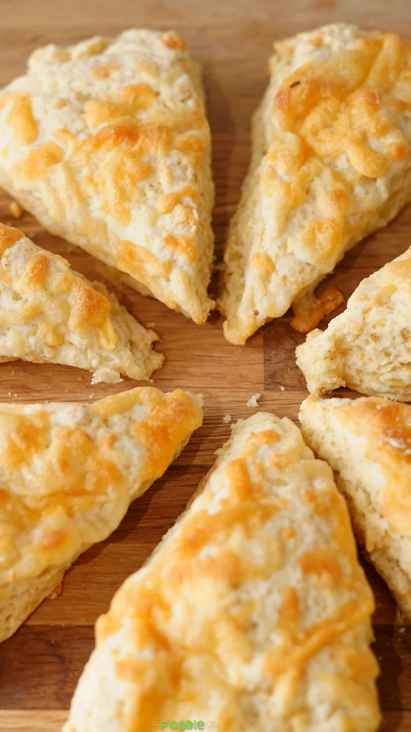 Close-up of fluffy Cheese Scones with golden melted cheese topping.