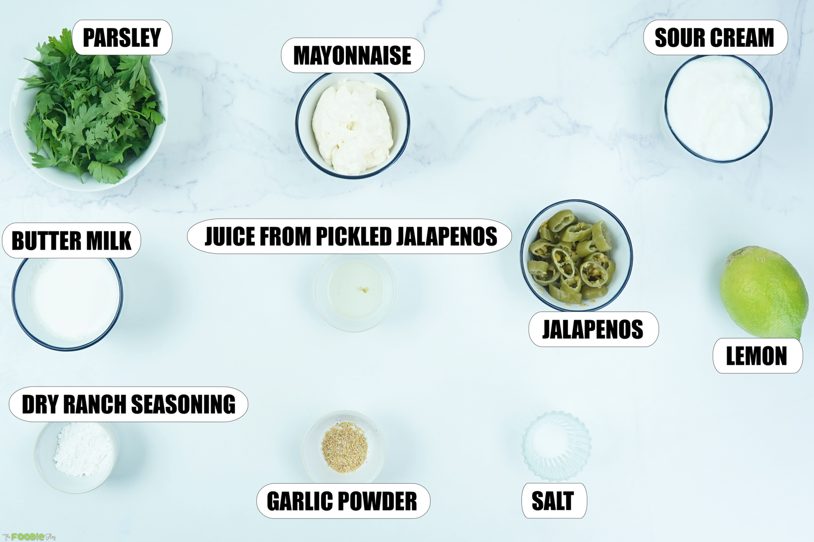 Cilantro, pickled jalapeños, mayonnaise, sour cream, ranch seasoning, lime, buttermilk, garlic powder, and salt for creamy jalapeño dip.