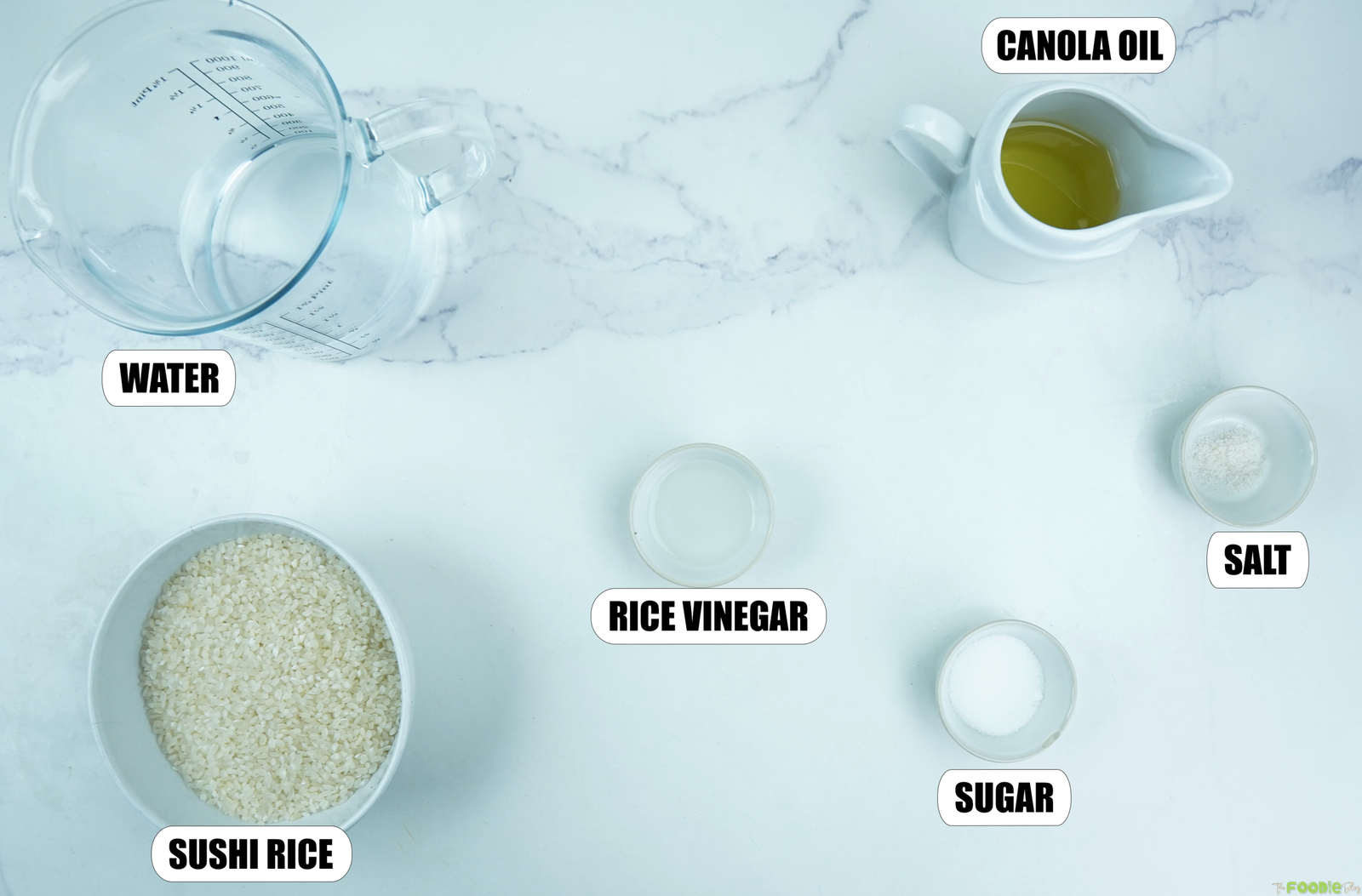 Ingredients for crispy rice recipe including sushi rice, water, rice vinegar, sugar, salt, and canola oil.