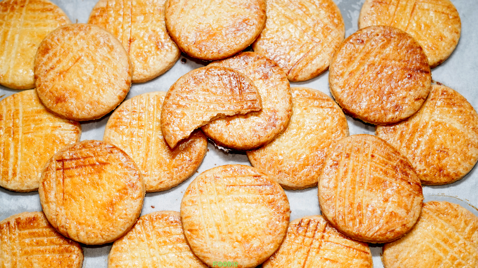 Golden baked Galettes Bretonnes with fork marks cooling on parchment paper.