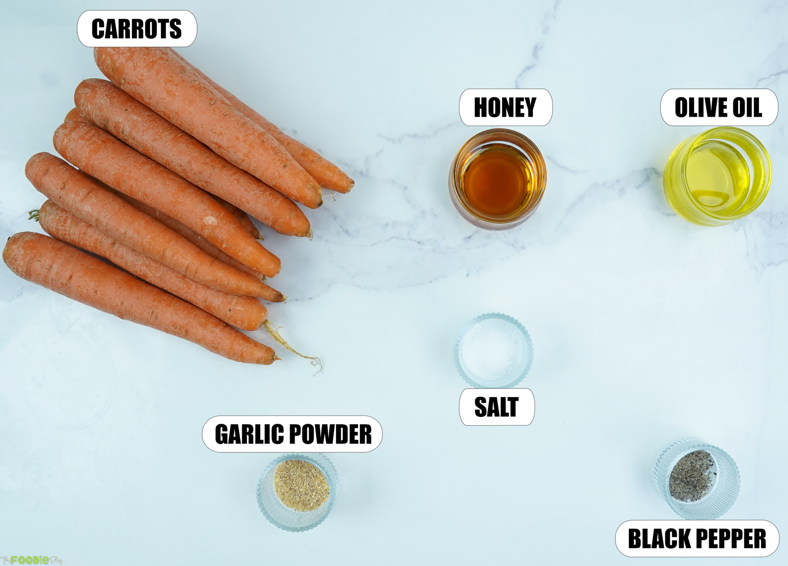 Ingredients for Honey Roasted Carrots with carrots, honey, olive oil, salt, garlic powder, and black pepper.