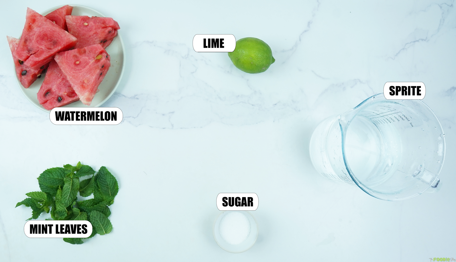 Watermelon, lime, mint leaves, sugar, and Sprite ingredients for a watermelon mojito mocktail.