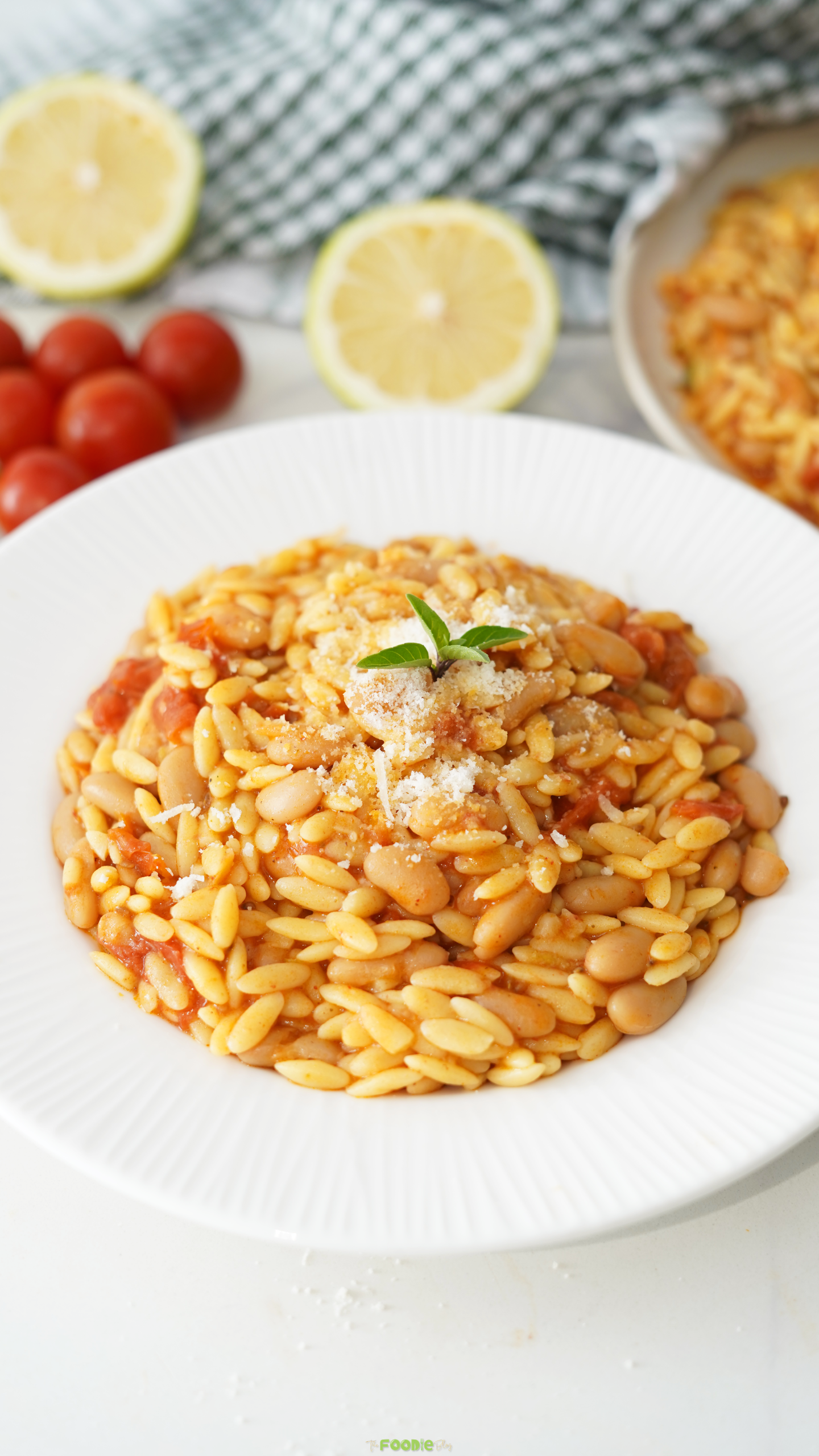 Cherry tomato orzo with creamy butter beans and grated Parmesan