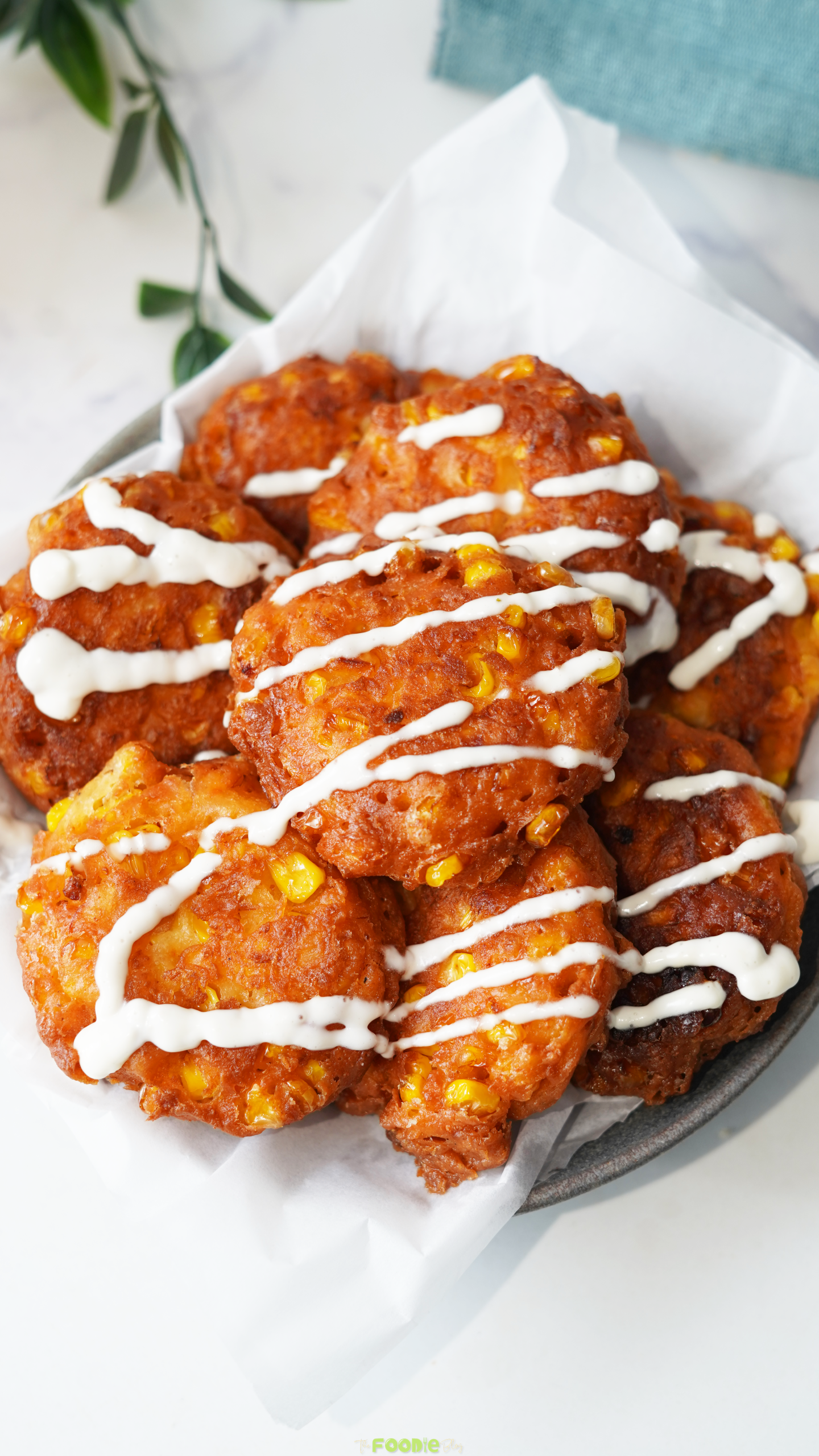 Crispy sweet corn fritters with golden edges and visible fresh corn kernels