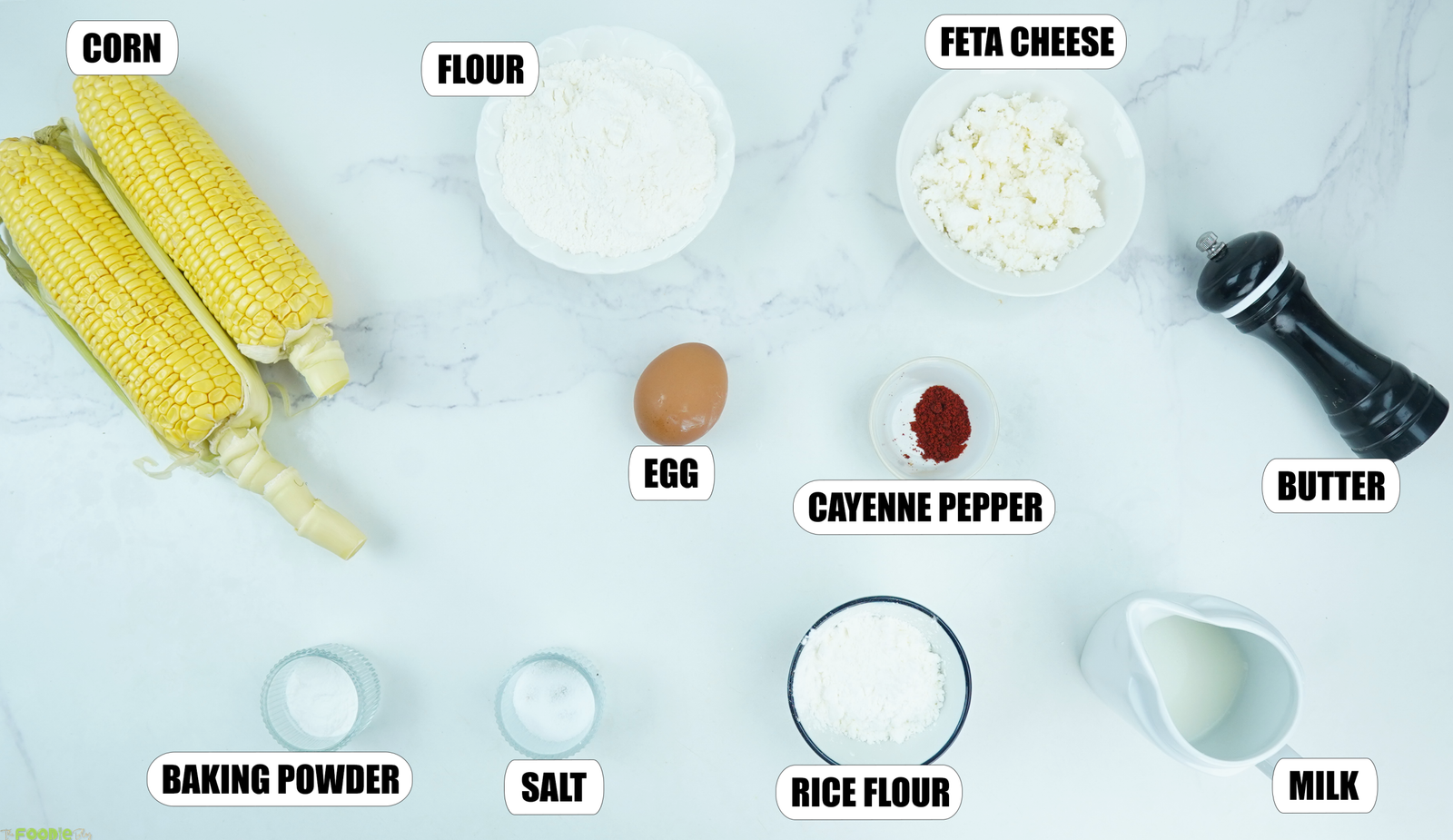 Fresh corn flour rice flour feta egg milk and seasonings for sweet corn fritters