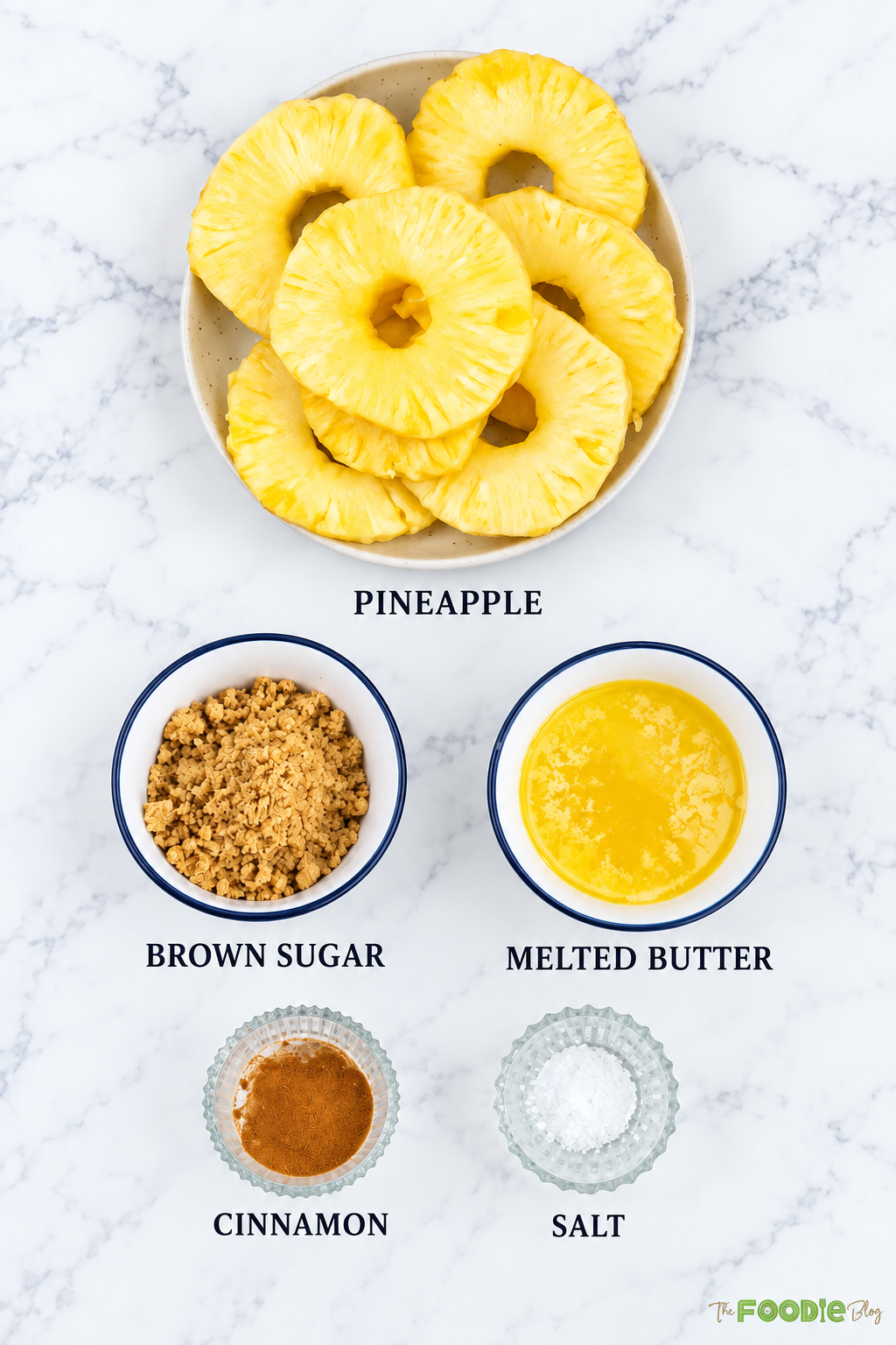 Ingredients for grilled pineapple including pineapple rings, brown sugar, melted butter, cinnamon, and salt