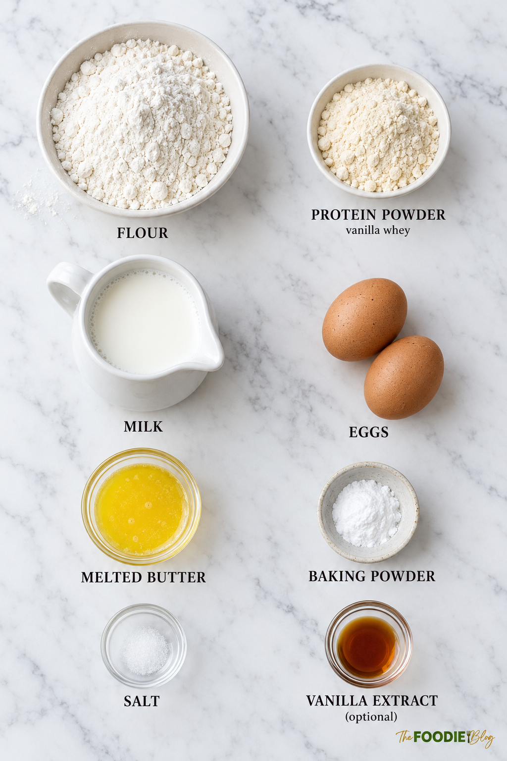 Ingredients for protein pancakes including flour, vanilla protein powder, milk, eggs, melted butter, baking powder, salt, and vanilla extract