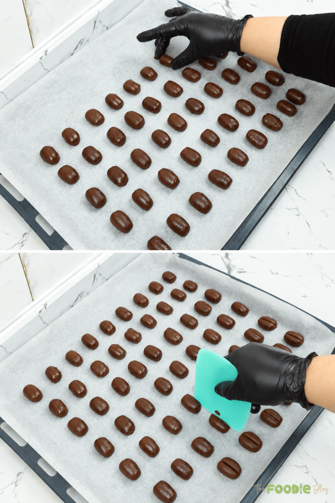 Coffee cookie dough pieces arranged on a parchment-lined baking tray