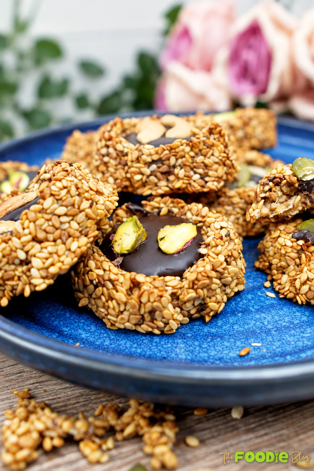 Finished sesame banana cookies with dark chocolate centers and assorted nuts