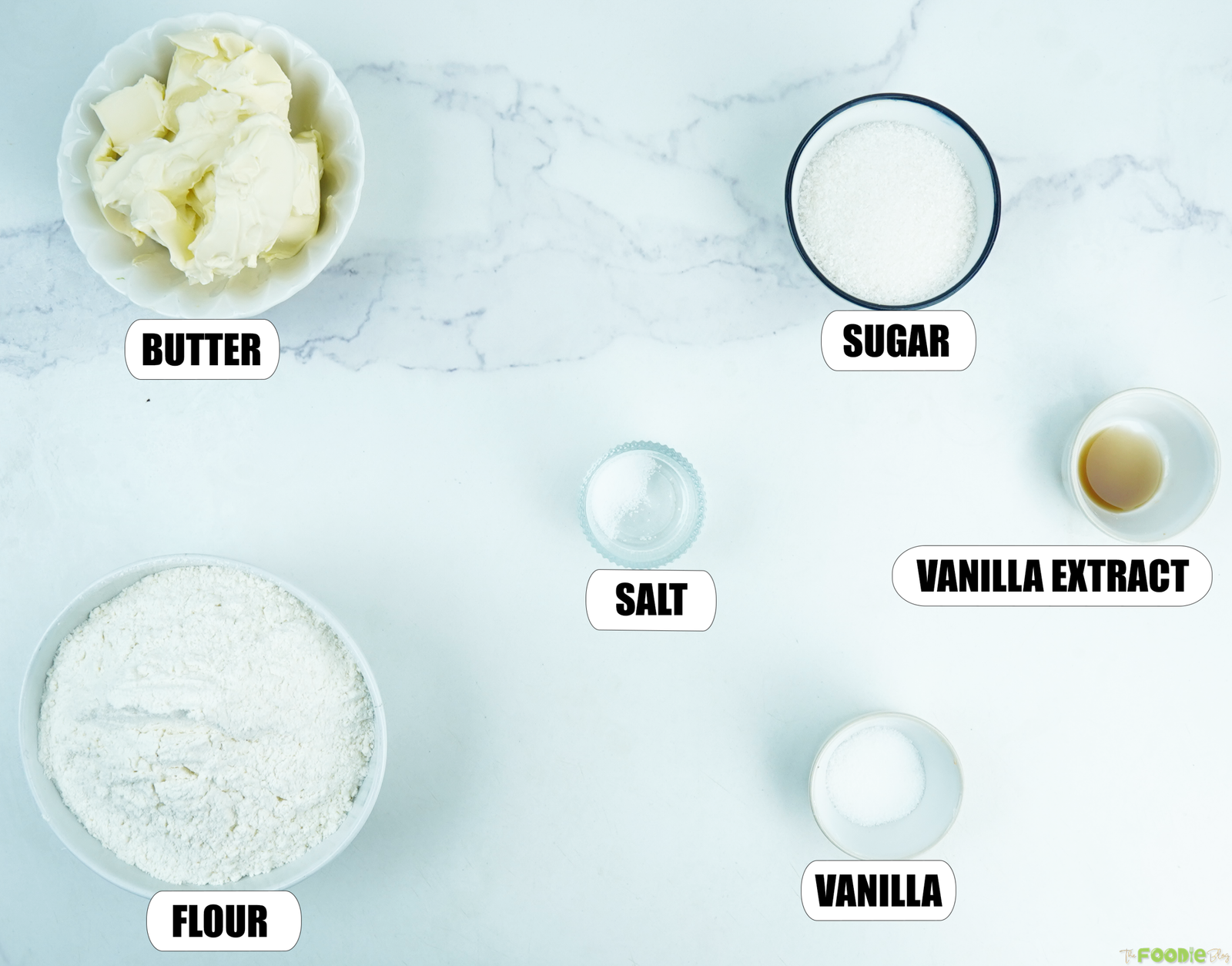 Butter, flour, sugar, vanilla, and salt for making French sable cookies.