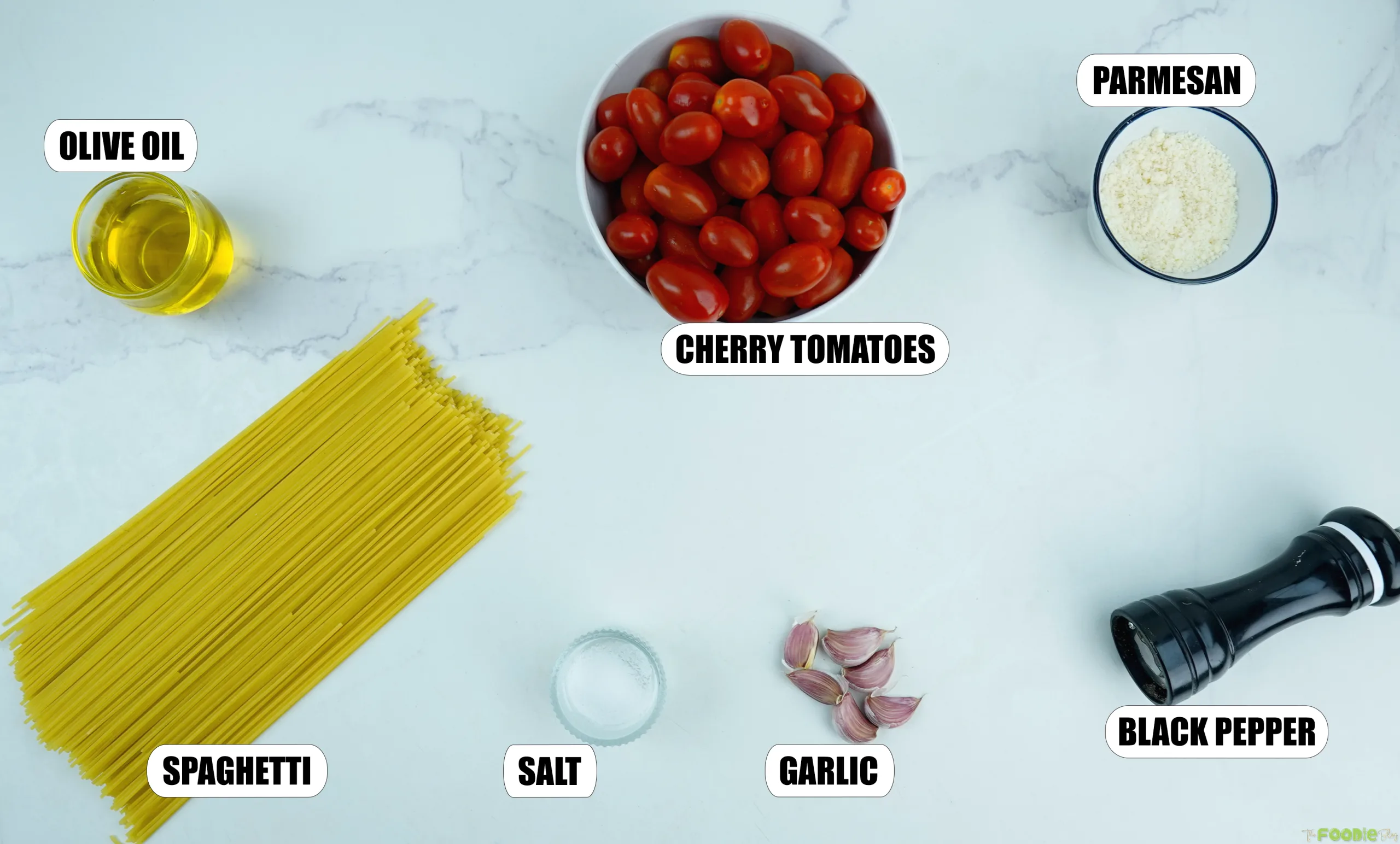 Spaghetti, cherry tomatoes, olive oil, garlic, Parmesan, salt, and black pepper for fresh tomato pasta.