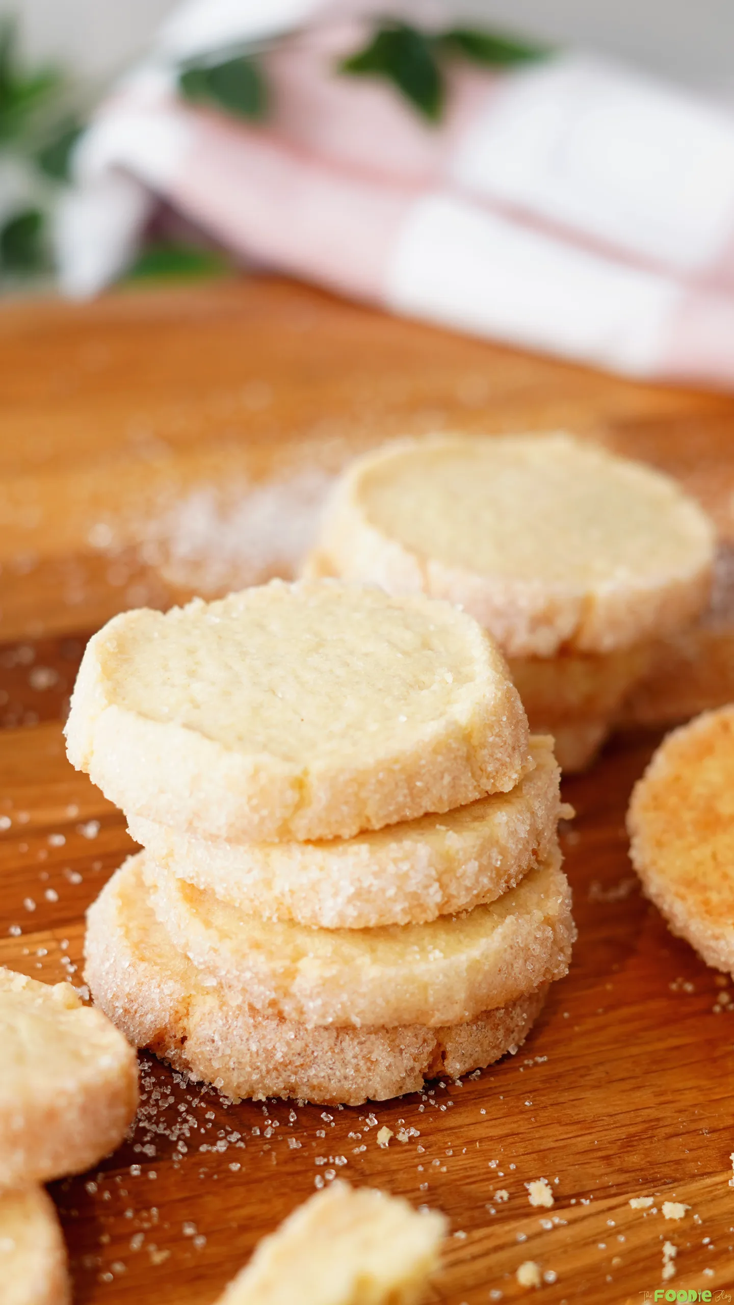 Close-up of round sable butter cookies with sparkling sugar around the edges.