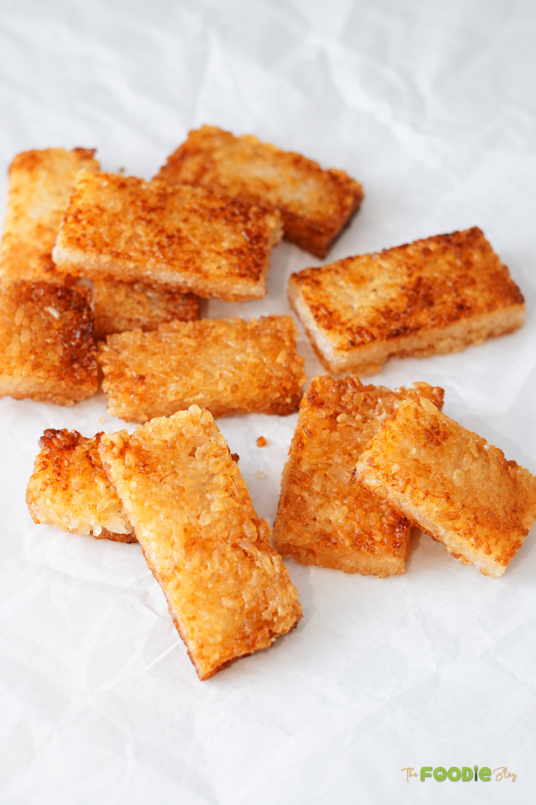 Golden crispy rice rectangles served plain with a crunchy browned exterior.
