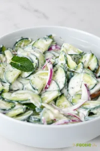 Creamy cucumber salad with Greek yogurt, red onion, and fresh mint.