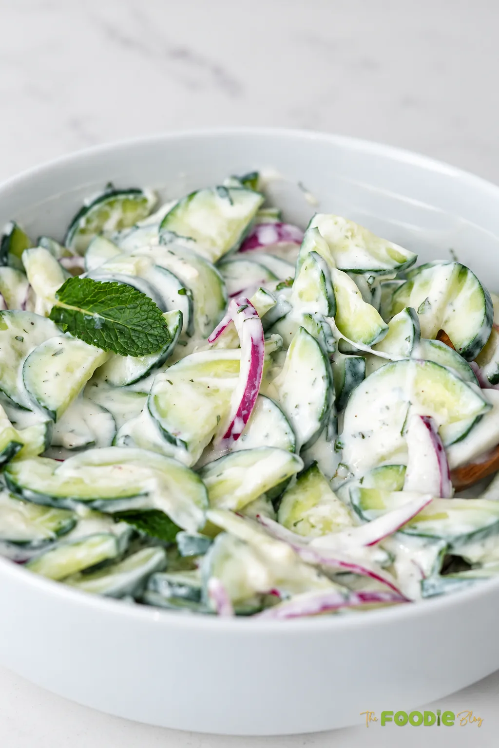 Creamy cucumber salad with Greek yogurt, red onion, and fresh mint.