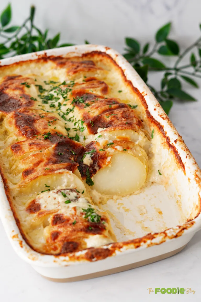 Easy cheesy scalloped potatoes baked with creamy sauce, mozzarella, and cheddar until golden brown.