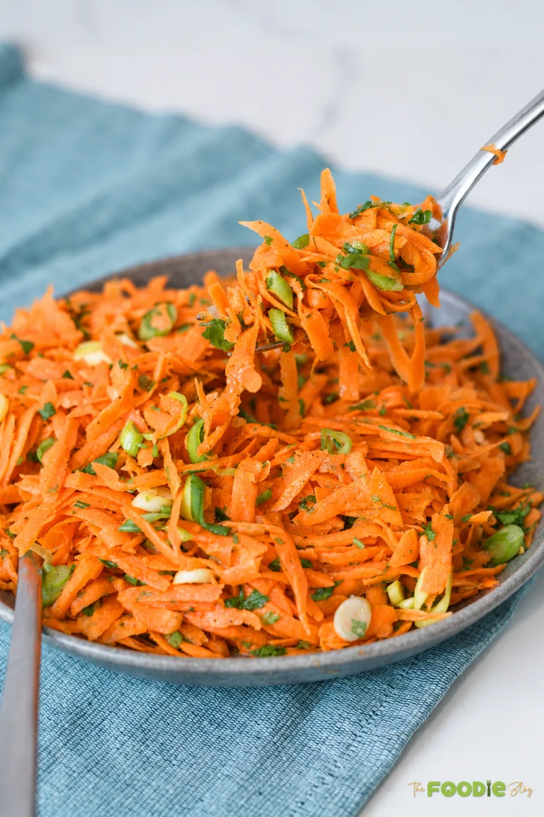 Grated carrot salad with green onions, parsley, and honey Dijon dressing.